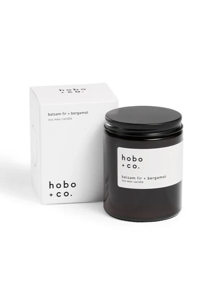 Hobo and Co branded candle in dark glass jar with black metal lid