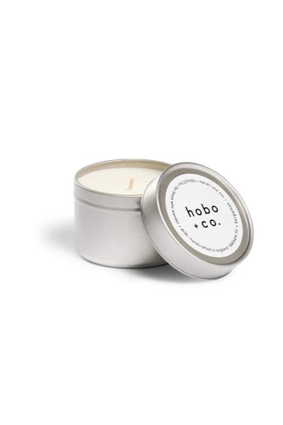 small white scented soy wax candle in Hobo + Co. branded silver tin