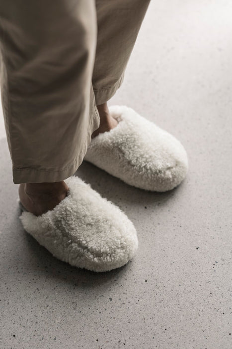 Jenny Sheepskin Slipper from Shepherd Is a curly slipper with a slip on back