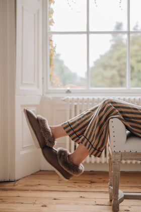 Relaxing in a pair Ladies Shearling Sheepskin Slipper boot 