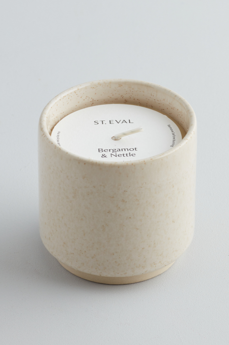 Bergamot & Nettle St. Eval fragranced candle in a sand coloured and inspired ceramic pot 