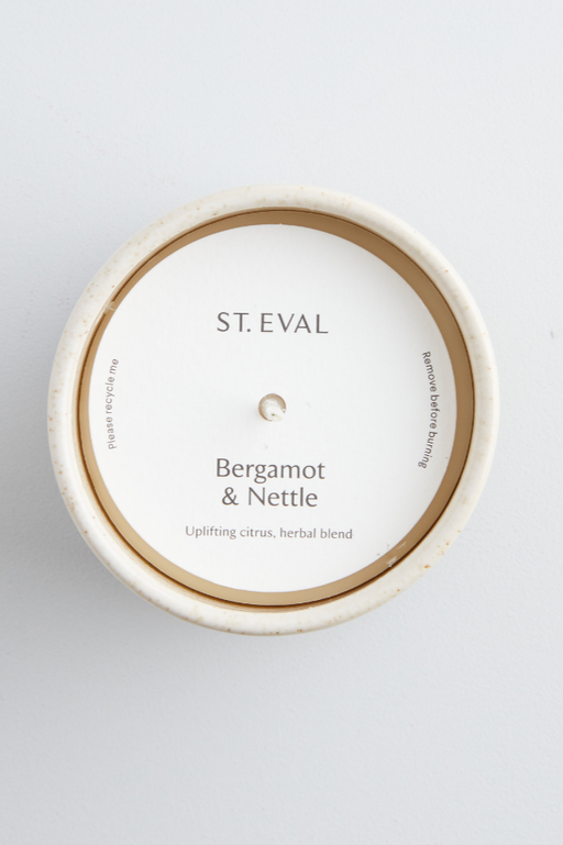 Bergamot & Nettle St. Eval fragranced candle in a sand coloured and inspired ceramic pot 