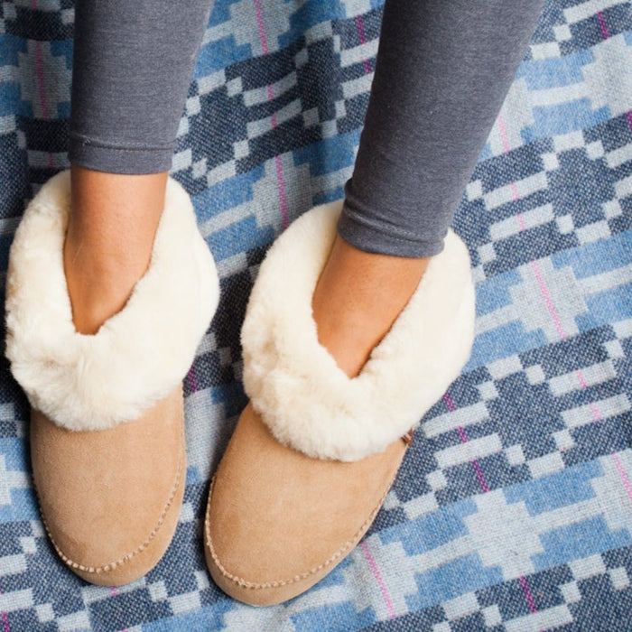 Sheepskin Slipper boot with cuff on the foot a model