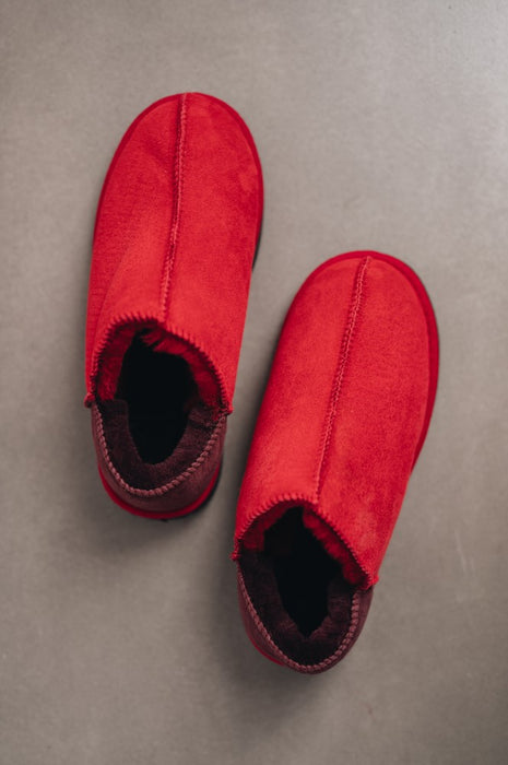 Durable red women’s sheepskin slippers with anti-slip soles for indoor and outdoor use