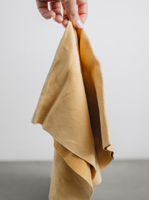 natural chamois leather cloth being held by model