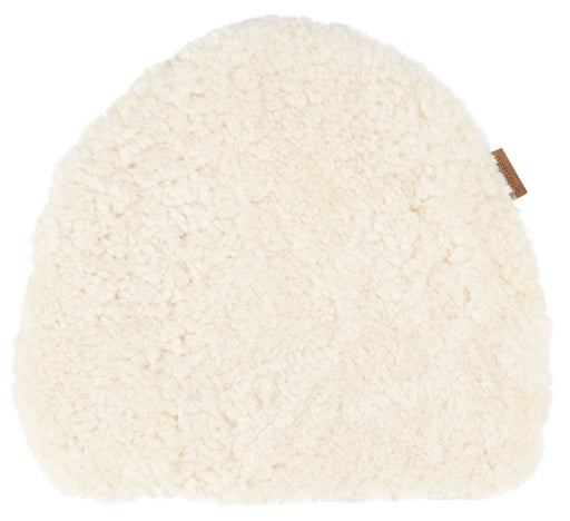 creme sheepskin seat pad on plain white background